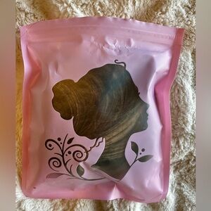 Kimi Hair synthetic hairpiece claw clip attachment. Lt brown/blonde highlights.